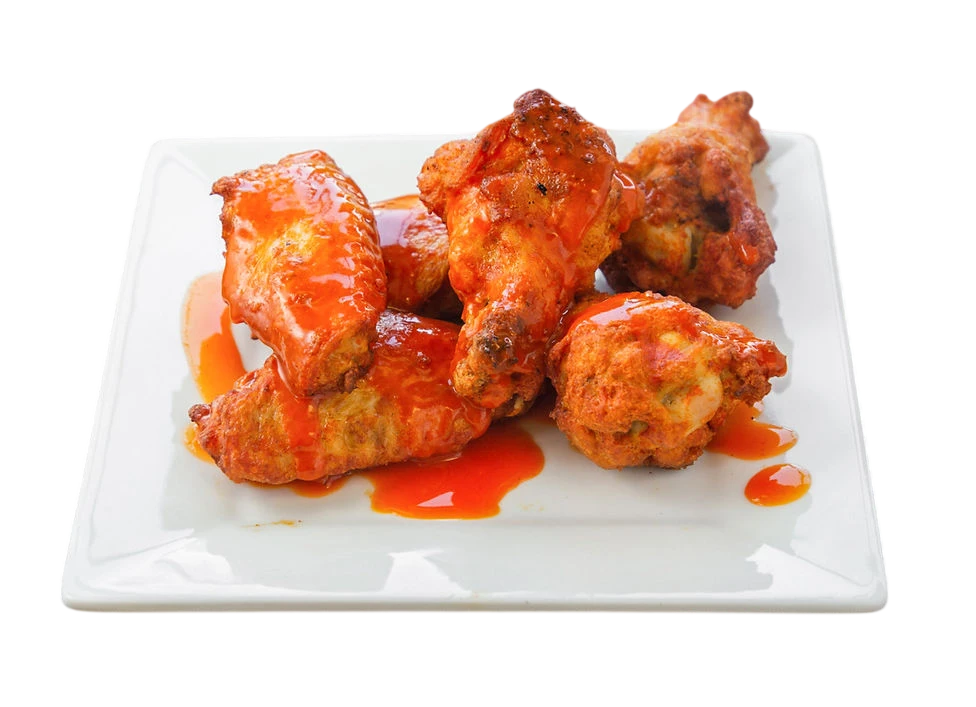 Plate of spicy chicken wings with sauce