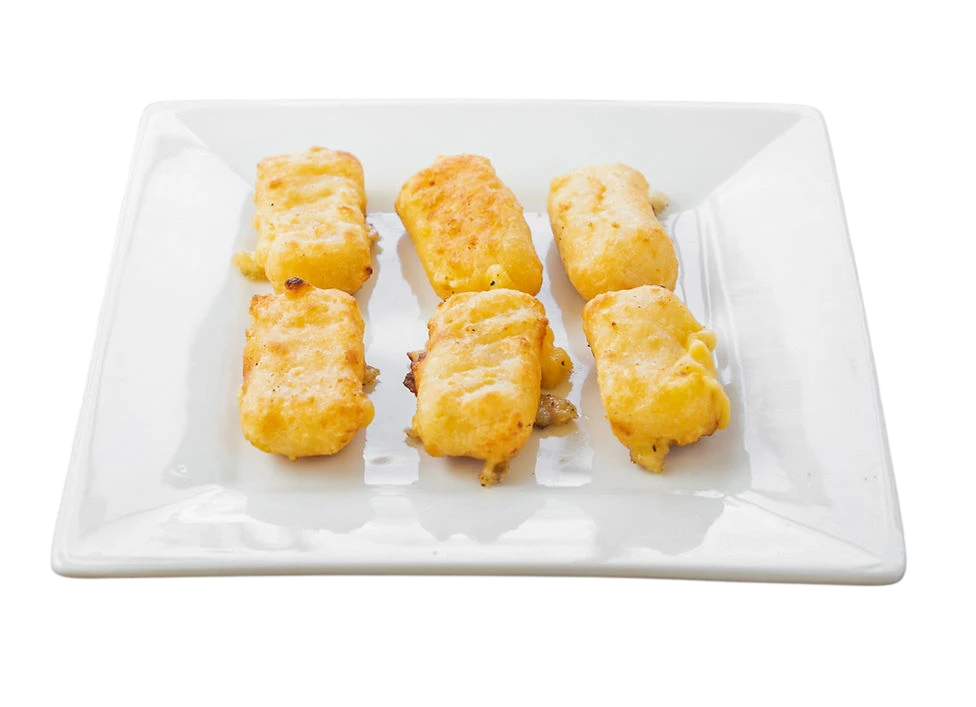 Golden fried cheese sticks on a white plate.