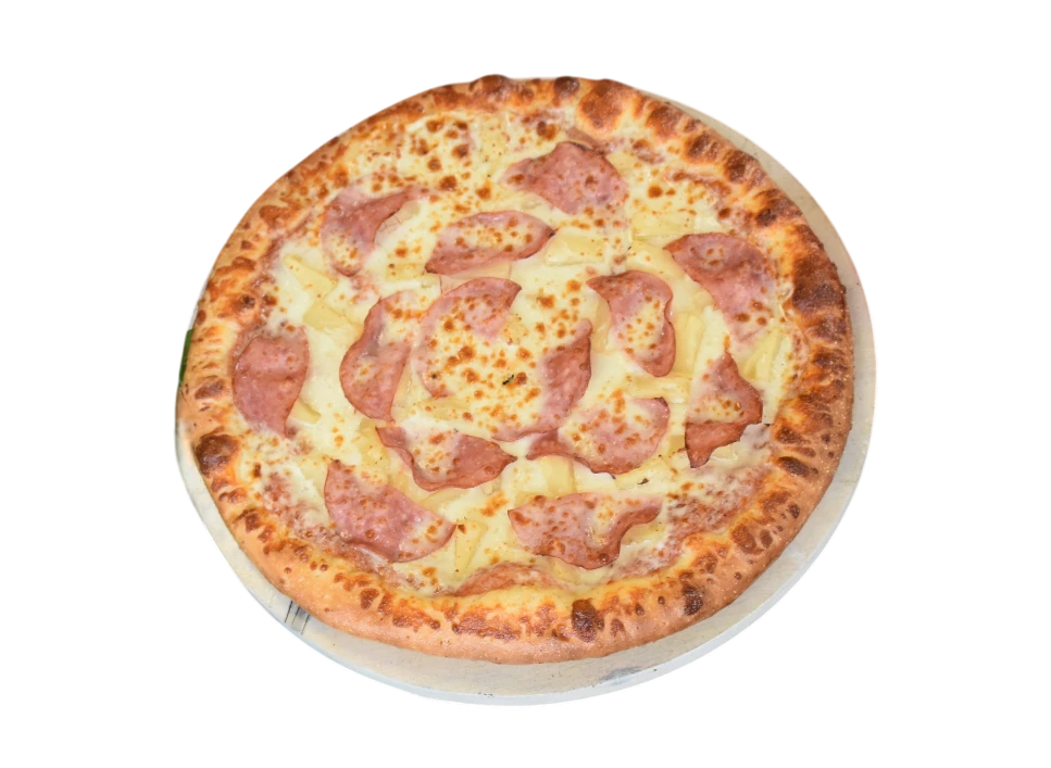 Delicious Hawaiian pizza topped with ham and pineapple