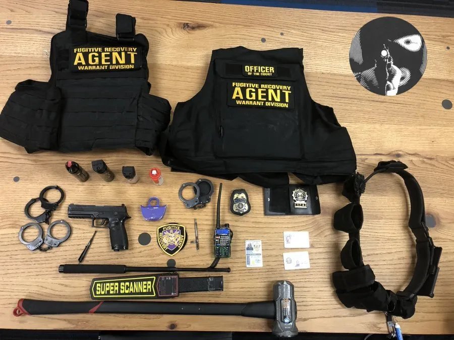 Law enforcement gear laid out on a table