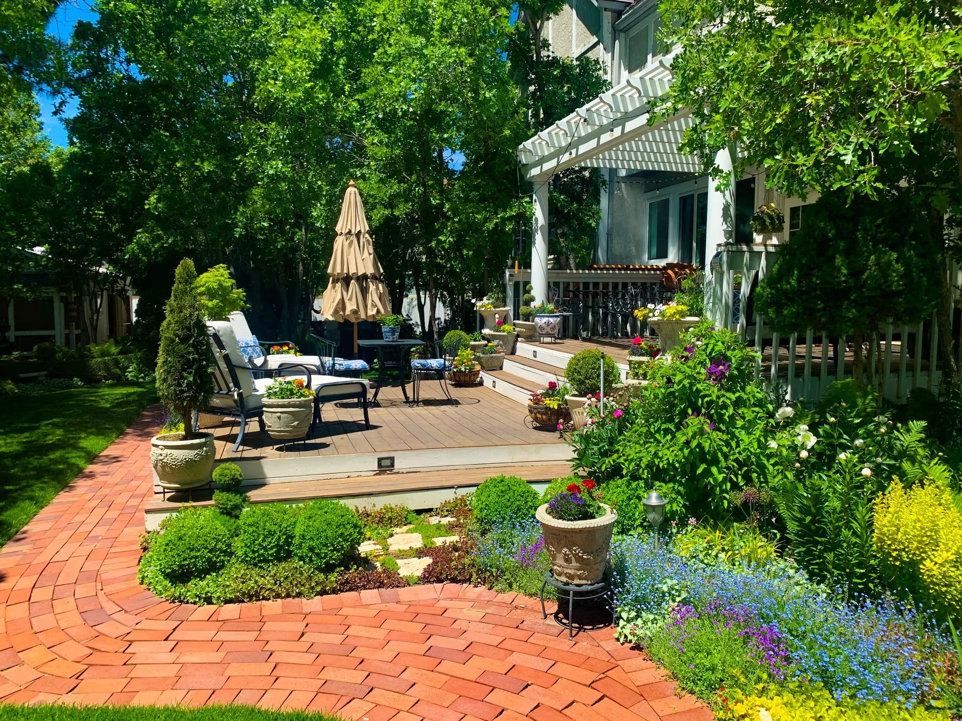 Beautiful backyard garden with patio and flowers