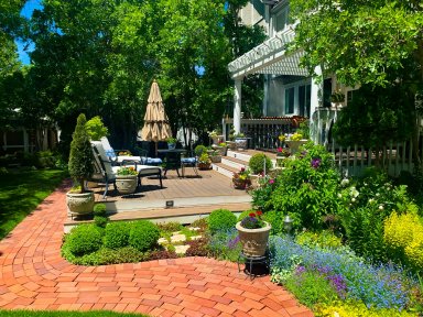 Beautiful backyard garden with patio and flowers