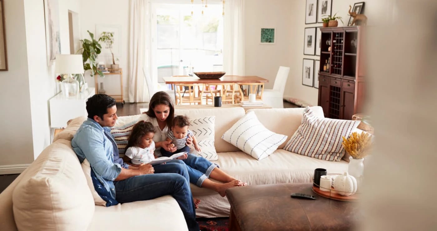 Family reading together in a cozy living room