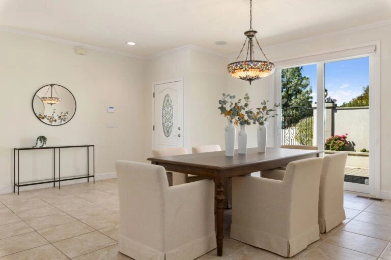 Elegant dining room with a wooden table and beige chairs