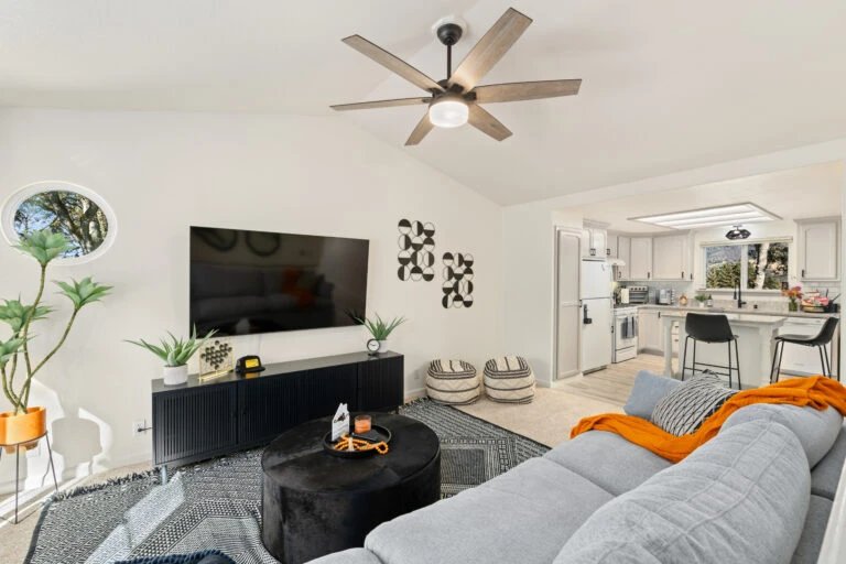 Modern living room with gray sectional sofa and flat-screen TV
