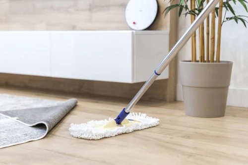 A mop cleaning a floor in a modern interior setting