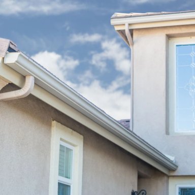 Home exterior with roof edge and blue sky