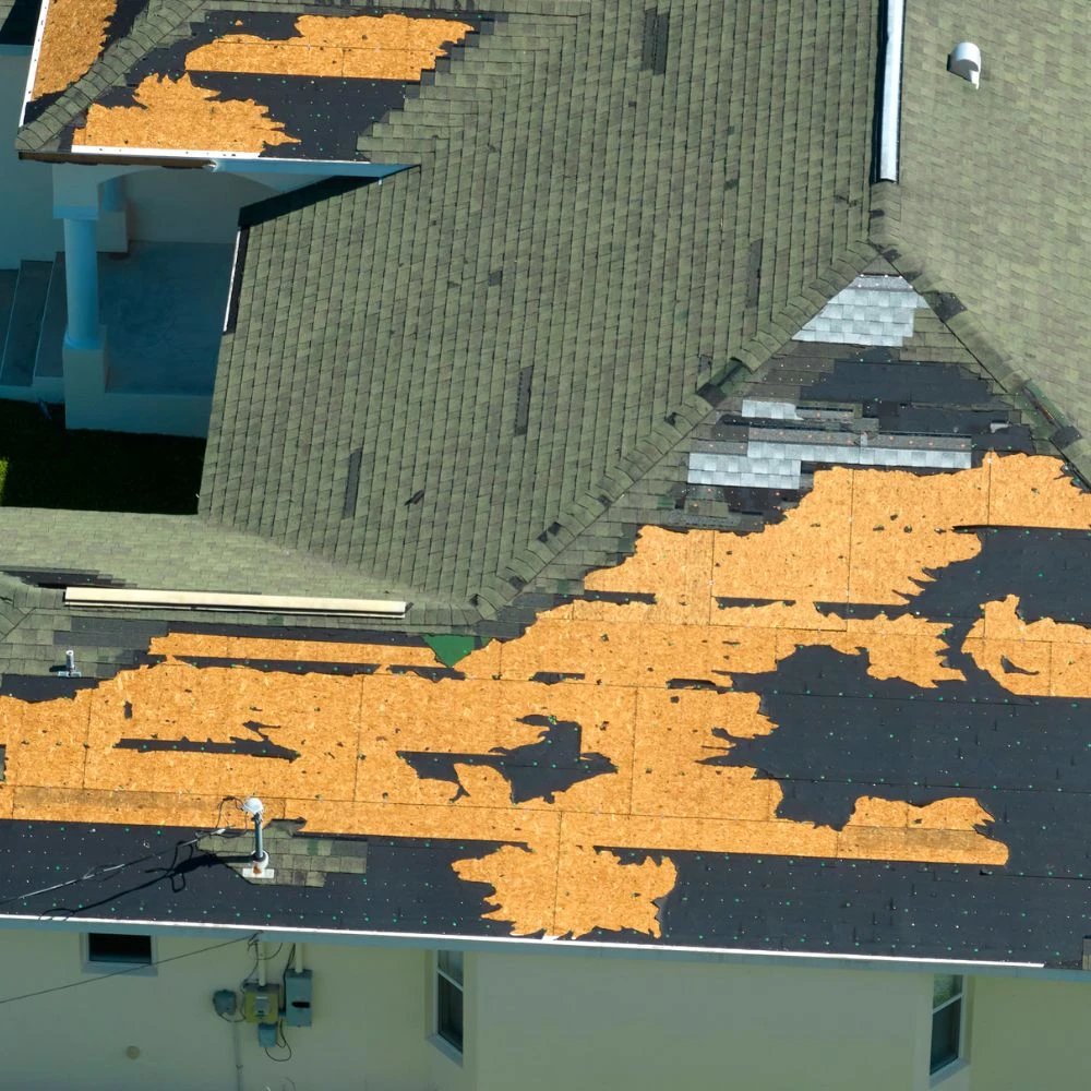 Roofing installation with shingles and underlayment showing progress