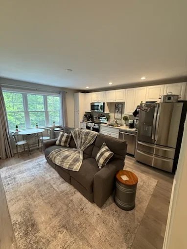Cozy modern living room with kitchen view