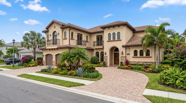 Luxurious home with landscaped garden and driveway