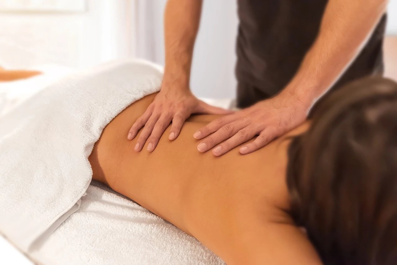 Massage therapy session with relaxing atmosphere