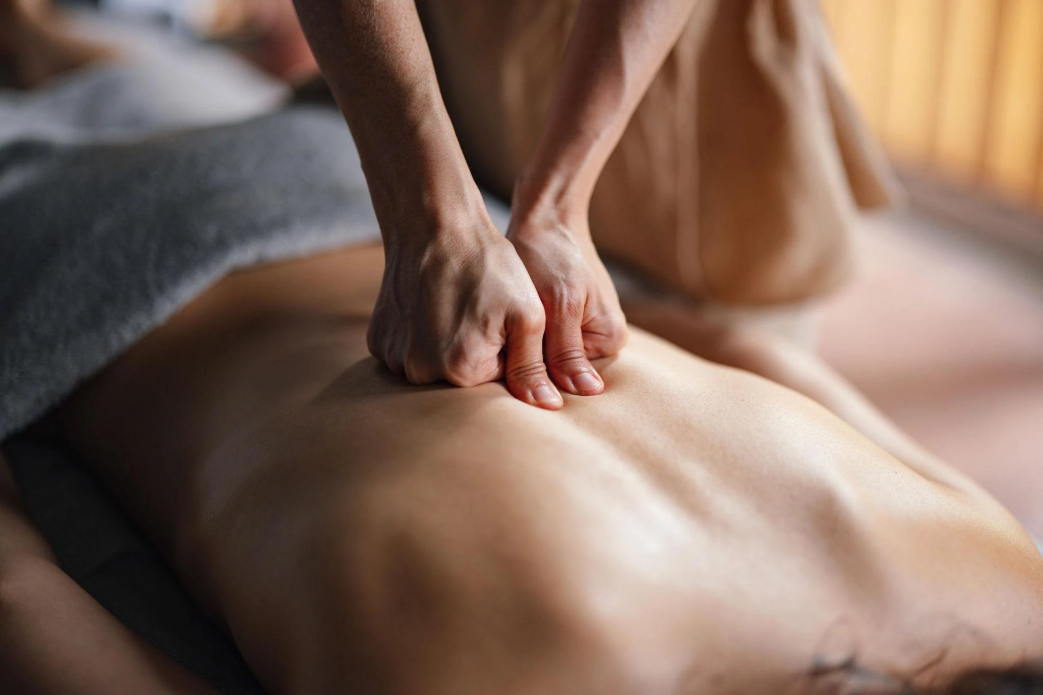 Massage therapy session focused on back muscle relief.