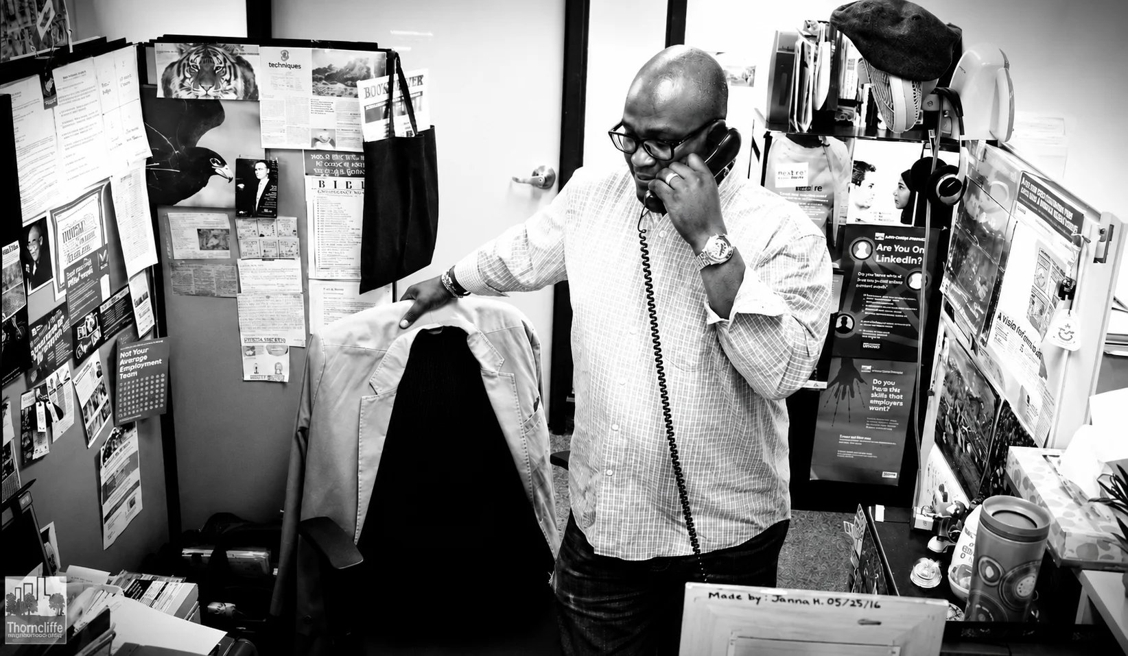 Businessman talking on the phone in a cluttered office