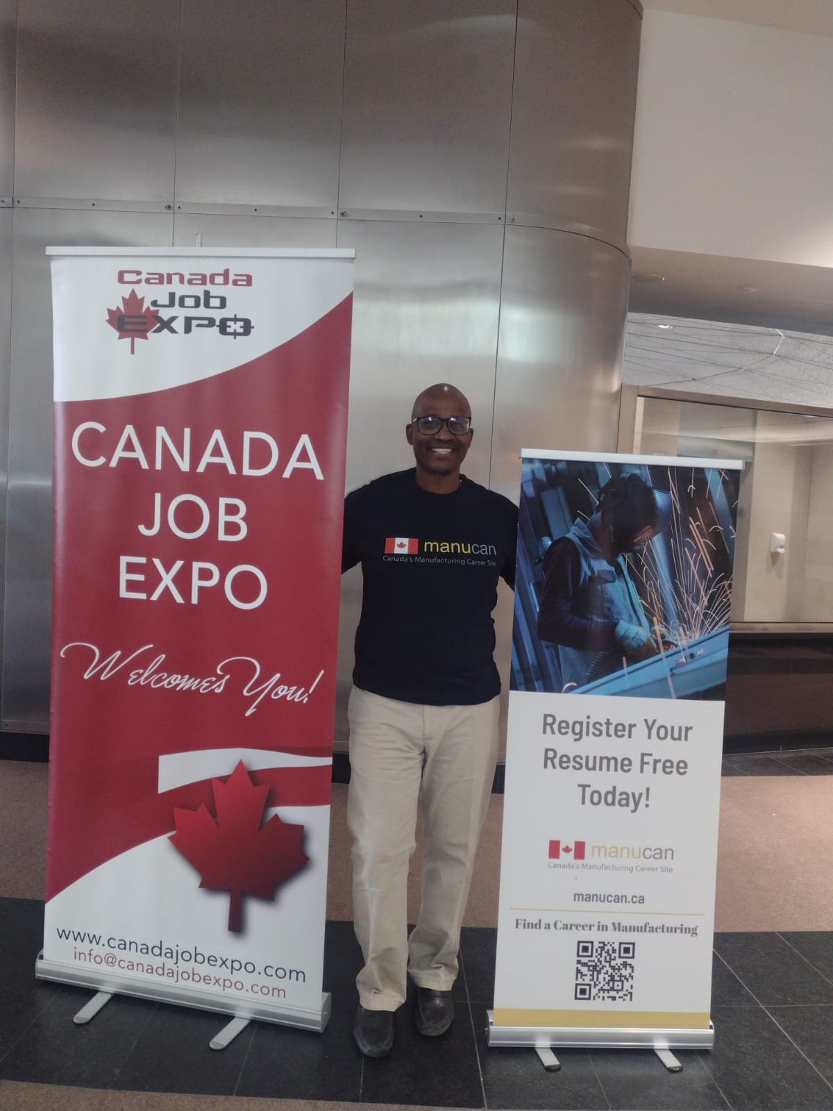 Job expo scene with banners and a smiling man
