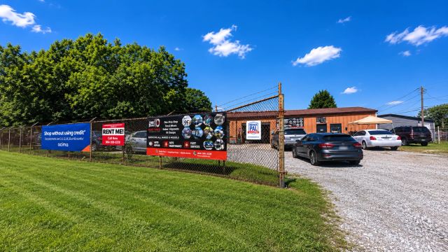 Outdoor business with rental signs and vehicles