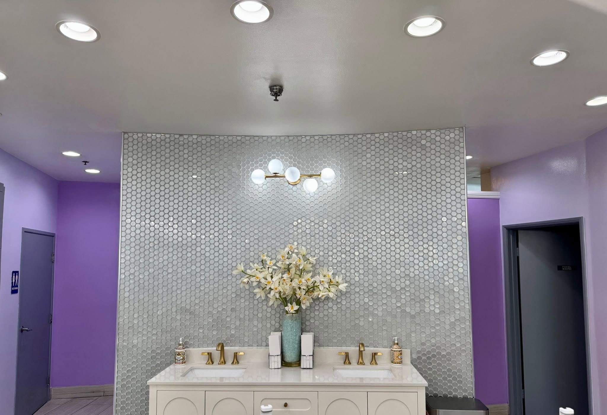Elegant bathroom interior with purple walls and modern fixtures