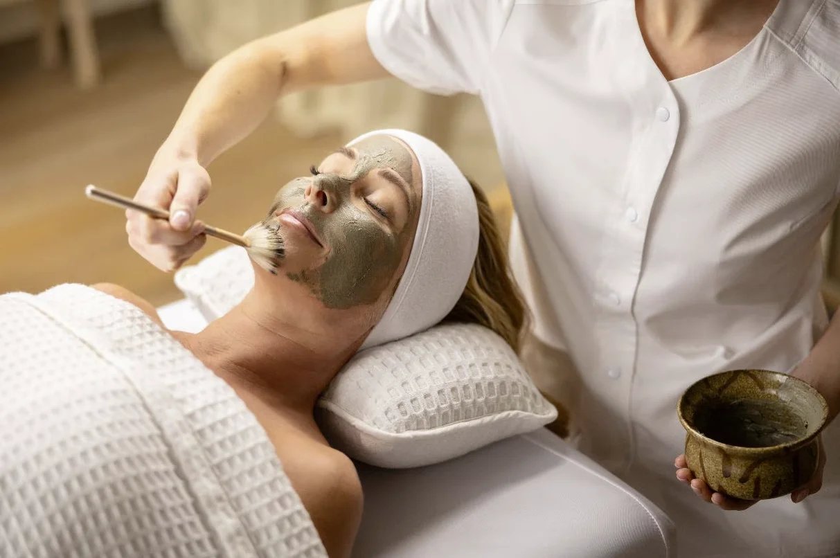 Woman receiving a facial treatment in a spa