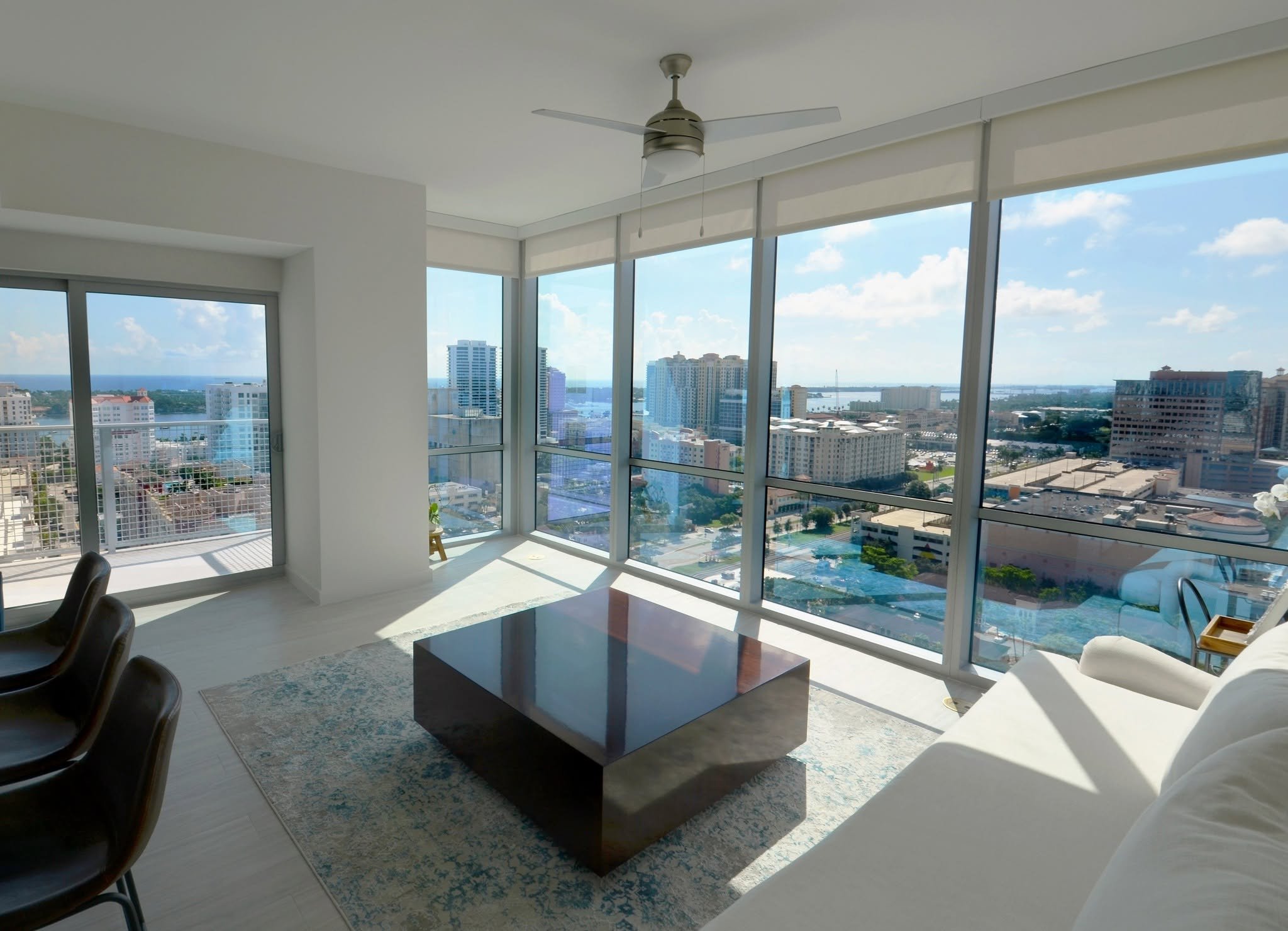 Modern living room with a city view and stylish furniture