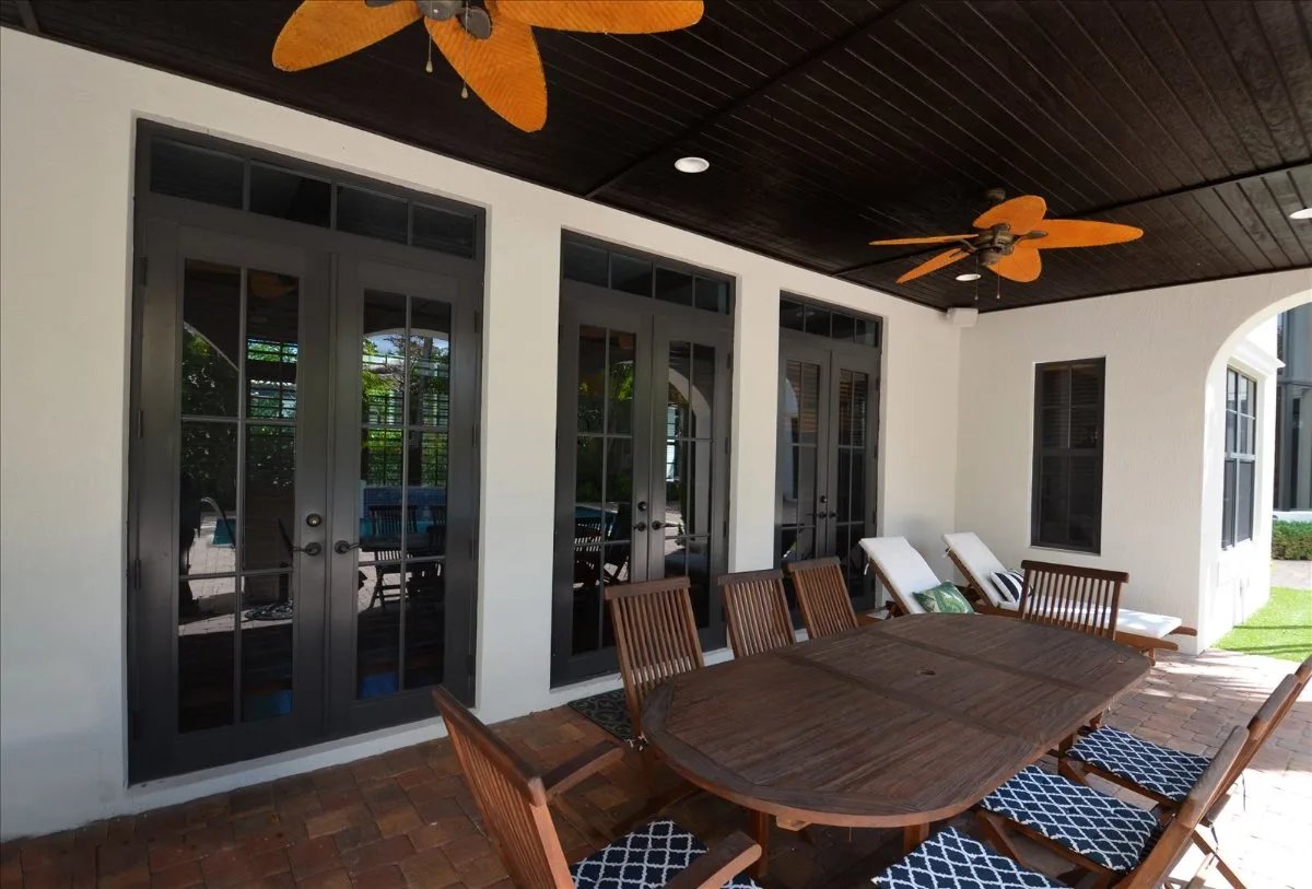 Outdoor dining area with wooden table and chairs