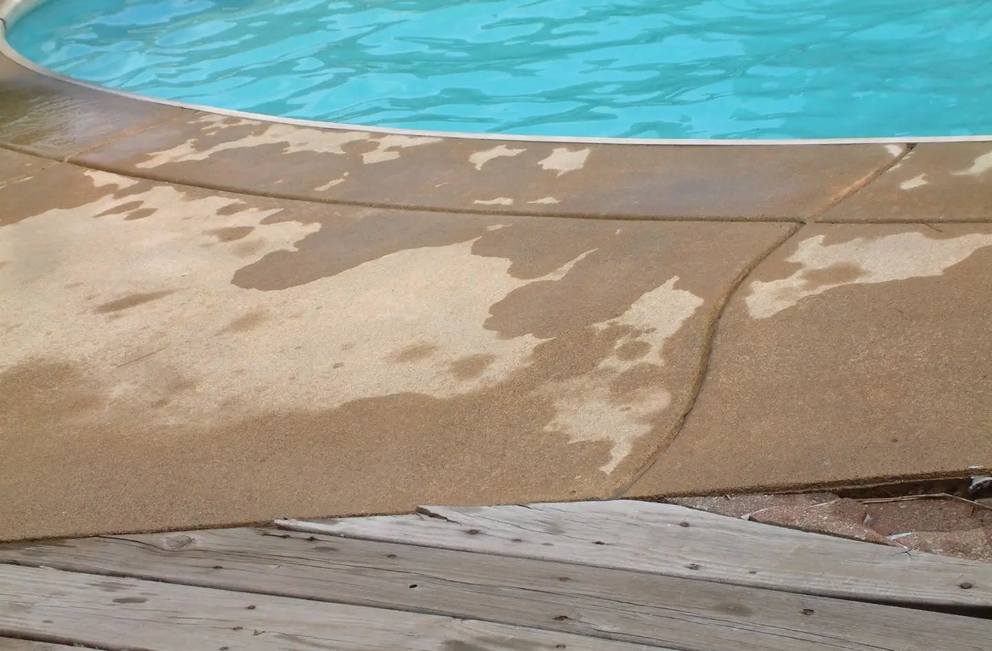 Surface of a swimming pool deck after rain