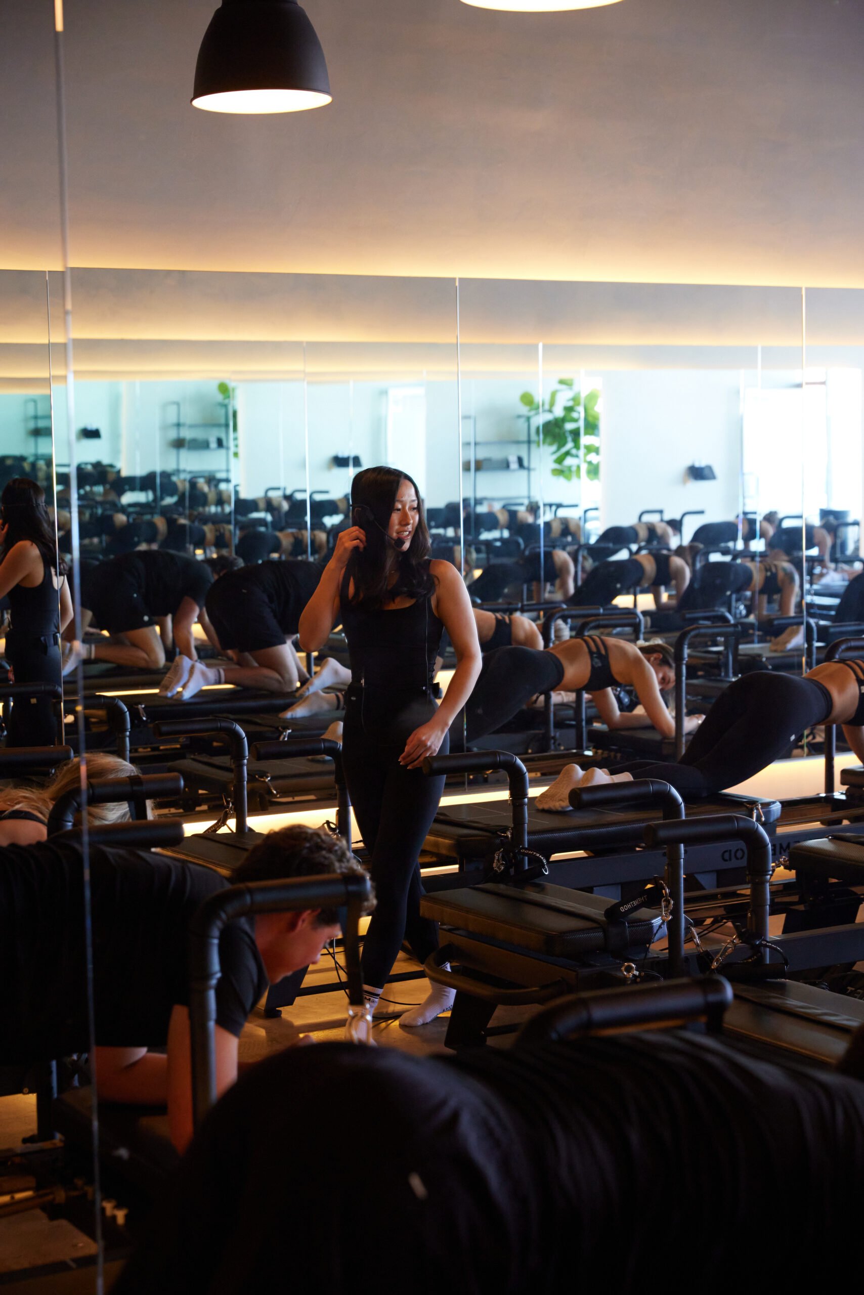 Woman in fitness studio with workout equipment