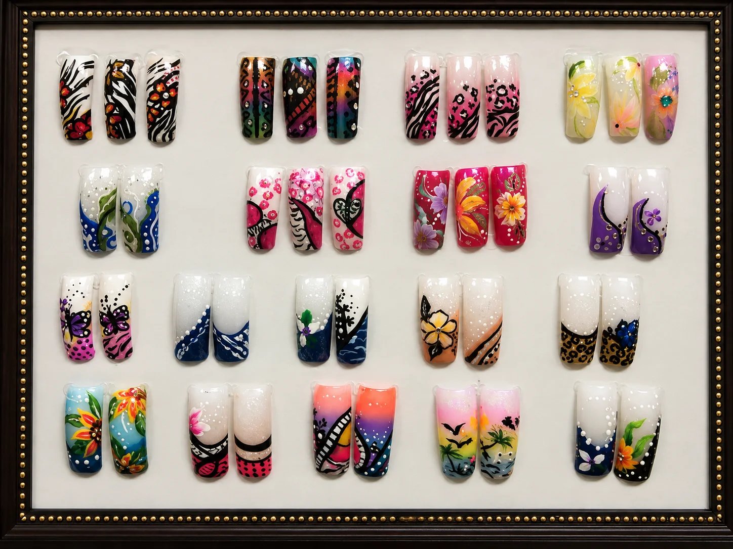 Colorful nail art designs arranged in a display.
