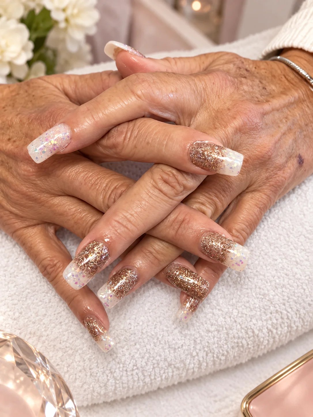 Close-up of manicured hands with glitter nails