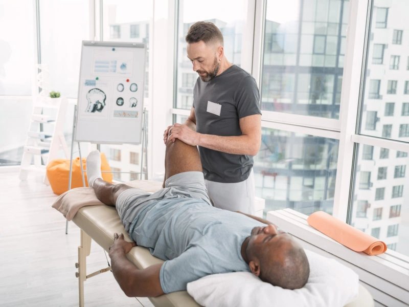 Physical therapist providing treatment to a patient
