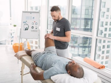 Physical therapist providing treatment to a patient