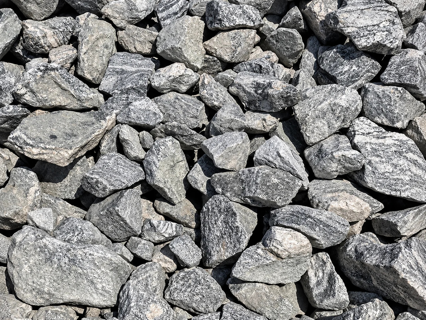 Close-up view of various gray rocks and gravel