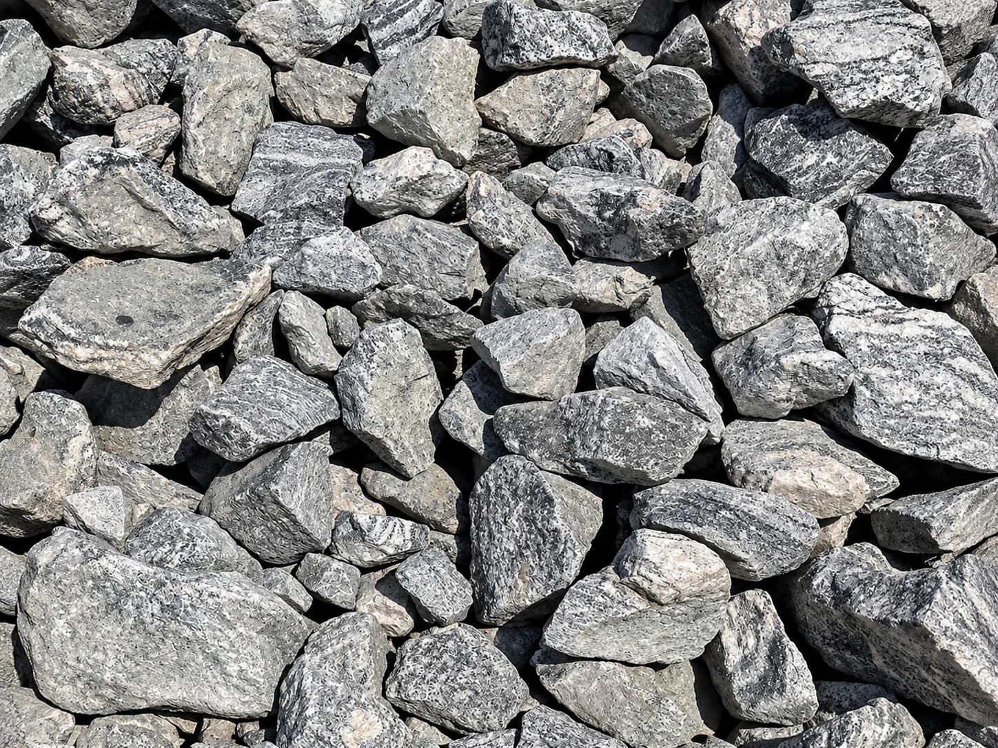 Close-up view of various gray rocks and gravel