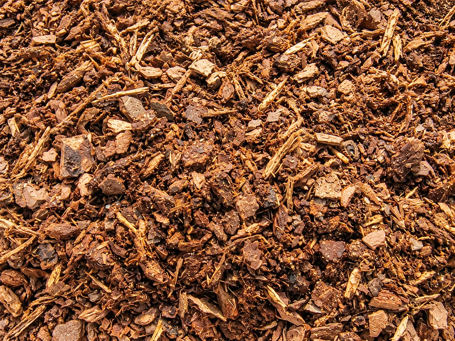 Close-up of textured mulch material in earthy tones