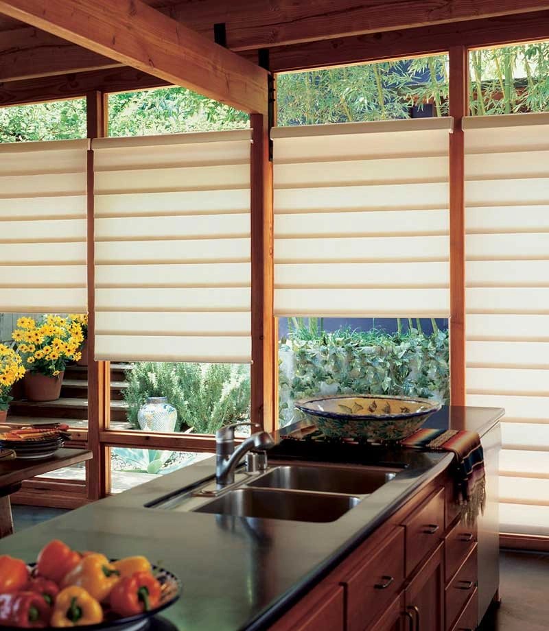 Elegant kitchen with soft window treatments and fresh produce.