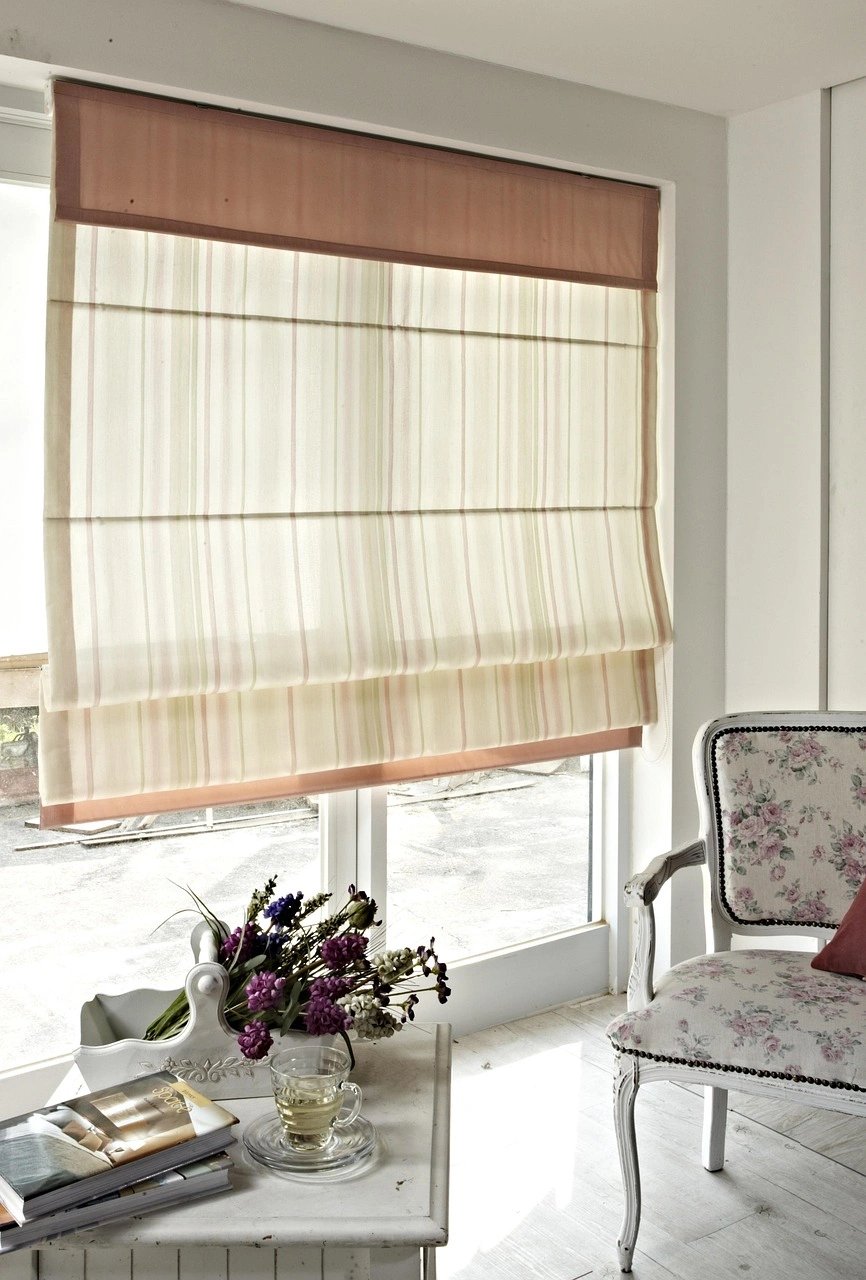 Interior view with floral chair and window blinds
