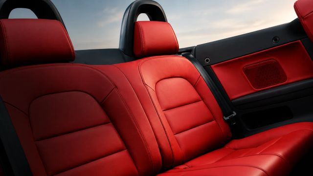 Luxurious red leather car interior showcasing seats.